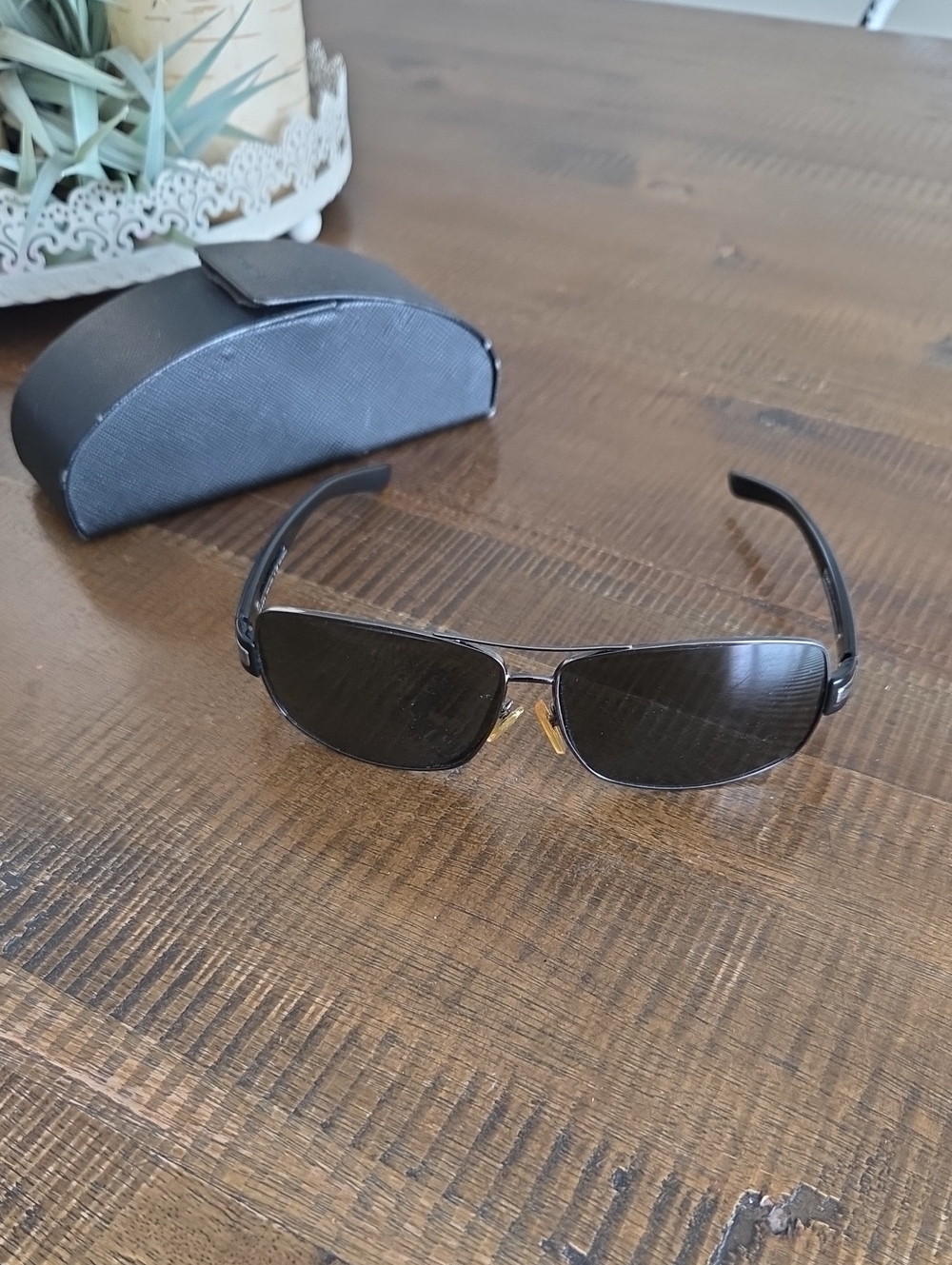 Prada Men’s Black Frame Sunglasses with Dark Lenses